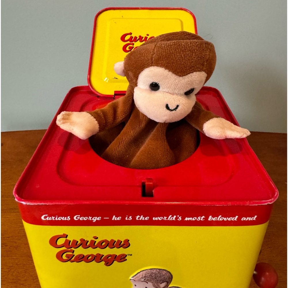 CURIOUS GEORGE  jack in the box toy. This adorable jack in the box plays music.